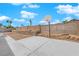 Spacious backyard featuring a concrete patio, basketball hoop, and block wall fencing at 7274 Pinebrook Cir, Las Vegas, NV 89147