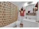 Bright bathroom featuring a shower-tub, vanity and mirror at 7274 Pinebrook Cir, Las Vegas, NV 89147