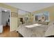 Comfortable bedroom with wood floors, natural light, and stylish decor at 7274 Pinebrook Cir, Las Vegas, NV 89147