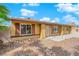 Charming front yard with rocks, trees, and covered entrance at 7274 Pinebrook Cir, Las Vegas, NV 89147