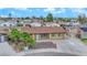 Charming single-story home with a well-maintained front yard and mature palm trees at 7274 Pinebrook Cir, Las Vegas, NV 89147