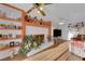 Bright living room with hardwood floors, fireplace, and display shelving at 7274 Pinebrook Cir, Las Vegas, NV 89147