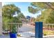A community view from the balcony showcases mature trees and a clear sky at 730 S Royal Crest Cir # 424, Las Vegas, NV 89169