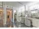 Elegant bathroom with vanity, decorative mirrors, and marble flooring offering a luxurious and sophisticated space at 730 S Royal Crest Cir # 424, Las Vegas, NV 89169