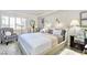 Stylishly decorated bedroom with a comfortable bed, elegant lighting, and a cozy reading chair at 730 S Royal Crest Cir # 424, Las Vegas, NV 89169