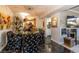 Open dining room with a modern light fixture, stylish chairs, and a view into the kitchen at 730 S Royal Crest Cir # 424, Las Vegas, NV 89169