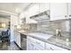 Well-appointed kitchen featuring sleek stainless steel appliances, granite countertops, and ample cabinet space at 730 S Royal Crest Cir # 424, Las Vegas, NV 89169