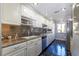 Well-appointed kitchen featuring granite countertops, modern appliances, and ample cabinet space at 730 S Royal Crest Cir # 424, Las Vegas, NV 89169