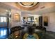 Open-concept living space with decorative chandelier, stylish furnishings, and ample natural light at 730 S Royal Crest Cir # 424, Las Vegas, NV 89169
