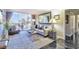 Bright living room featuring plush carpet, large windows, modern decor, fireplace, and entertainment center at 730 S Royal Crest Cir # 424, Las Vegas, NV 89169