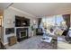 Comfortable living room with fireplace, media center, and access to the balcony at 730 S Royal Crest Cir # 424, Las Vegas, NV 89169