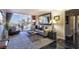 Cozy living room features plush carpeting, large windows, and comfortable seating at 730 S Royal Crest Cir # 424, Las Vegas, NV 89169