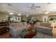 Large living room with tile floors, ceiling fans, and couches for comfortable seating at 730 S Royal Crest Cir # 424, Las Vegas, NV 89169
