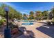 Community pool and spa surrounded by mature landscaping under a clear blue sky at 730 S Royal Crest Cir # 424, Las Vegas, NV 89169