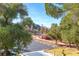 Balcony with a view overlooking mature trees, parking lot and lush landscaping at 730 S Royal Crest Cir # 424, Las Vegas, NV 89169