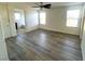 Inviting living room featuring modern floors, neutral paint and plenty of natural light at 7342 Caballo Range Ave, Las Vegas, NV 89179