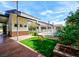 A luxurious backyard featuring an outdoor pool, patio, green turf, and mature landscaping that offers seclusion at 7565 N Torrey Pines Dr # A, Las Vegas, NV 89131