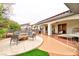 Backyard features a patio with fire pit, lounge chairs, and landscaping, perfect for relaxing and entertaining guests at 7565 N Torrey Pines Dr # A, Las Vegas, NV 89131