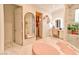 A Primary bathroom featuring a vanity, open door to closet, and walk-in shower at 7565 N Torrey Pines Dr # A, Las Vegas, NV 89131