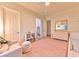 Bedroom with pink rug and cozy reading nook at 7565 N Torrey Pines Dr # A, Las Vegas, NV 89131