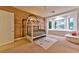 Bright bedroom with a house-frame bed, natural light, and playful decor at 7565 N Torrey Pines Dr # A, Las Vegas, NV 89131