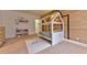 bedroom features a house-frame bed, colorful rug, and playful wall art at 7565 N Torrey Pines Dr # A, Las Vegas, NV 89131