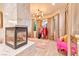A lavish dressing room featuring a marble fireplace, elegant lighting, and custom shelving at 7565 N Torrey Pines Dr # A, Las Vegas, NV 89131