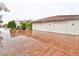 Spacious three car garage surrounded by a large driveway on a cloudy day at 7565 N Torrey Pines Dr # A, Las Vegas, NV 89131
