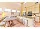 Well-lit kitchen with a large island, stainless steel appliances, granite countertops, and cozy seating at 7565 N Torrey Pines Dr # A, Las Vegas, NV 89131