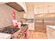 Bright kitchen features stainless steel appliances and herringbone backsplash at 7565 N Torrey Pines Dr # A, Las Vegas, NV 89131