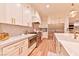 Bright kitchen features stainless steel appliances, white cabinets, and marble counters at 7565 N Torrey Pines Dr # A, Las Vegas, NV 89131