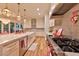 Bright kitchen features stainless steel appliances, white cabinets, and marble counters at 7565 N Torrey Pines Dr # A, Las Vegas, NV 89131