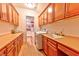 Spacious laundry room with ample cabinetry, countertops, and modern appliances at 7565 N Torrey Pines Dr # A, Las Vegas, NV 89131