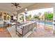 Covered patio with comfortable seating, a pool view, and outdoor entertaining space at 7565 N Torrey Pines Dr # A, Las Vegas, NV 89131
