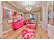 Walk-in closet with custom cabinets, art, and a heart-shaped rug at 7565 N Torrey Pines Dr # A, Las Vegas, NV 89131