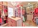 The well-organized walk-in closet is equipped with custom shelves and clothing racks at 7565 N Torrey Pines Dr # A, Las Vegas, NV 89131