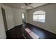 Bright bedroom with dark wood floors, a ceiling fan, and natural lighting at 8455 W Sahara Ave # 226, Las Vegas, NV 89117