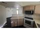 Well-lit kitchen with updated appliances and a breakfast bar at 8455 W Sahara Ave # 226, Las Vegas, NV 89117