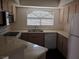 Clean kitchen with neutral-toned cabinets and modern appliances at 8455 W Sahara Ave # 226, Las Vegas, NV 89117