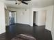 Bright living room with dark wood floors and sliding glass door at 8455 W Sahara Ave # 226, Las Vegas, NV 89117