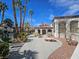 Community pool area with palm trees and seating, perfect for relaxation at 8455 W Sahara Ave # 226, Las Vegas, NV 89117