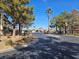 Neighborhood street view with trees lining the road at 8455 W Sahara Ave # 226, Las Vegas, NV 89117