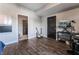 Bedroom setup as an office, featuring wood flooring, a desk, and musical instruments at 8925 W Flamingo Rd # 208, Las Vegas, NV 89147