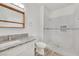 Stylish bathroom with step-in shower, granite counters, and wood-look floors at 9050 W Warm Springs Rd # 2153, Las Vegas, NV 89148