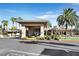 Inviting clubhouse entrance with palm trees and a covered porte-cochère at 9050 W Warm Springs Rd # 2153, Las Vegas, NV 89148