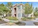 Charming condo complex featuring well-maintained landscaping and inviting walkways at 9050 W Warm Springs Rd # 2153, Las Vegas, NV 89148