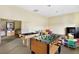 Bright community game room featuring a foosball table, billiards table, and comfortable seating at 9050 W Warm Springs Rd # 2153, Las Vegas, NV 89148