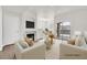 Bright staged living room with fireplace, light neutral walls and access to private patio at 9050 W Warm Springs Rd # 2153, Las Vegas, NV 89148