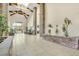 Grand lobby featuring soaring ceilings, stone accents, and lush indoor plants at 9050 W Warm Springs Rd # 2153, Las Vegas, NV 89148