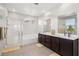 Modern bathroom featuring double vanity, separate shower, and bathtub with elegant fixtures at 9690 Hiking Ave, Las Vegas, NV 89166